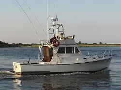 Sport fishing boat off Tampa, Florida, with Signature Series Gas Springs used for multiple storage hatch lids.