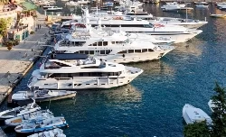 Yachts docked in a Florida harbor seeking gas springs from a marine supplier